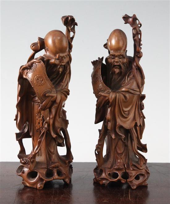 Two Chinese boxwood standing figures of Shou Lao, 20th century, 19.5cm and 20cm